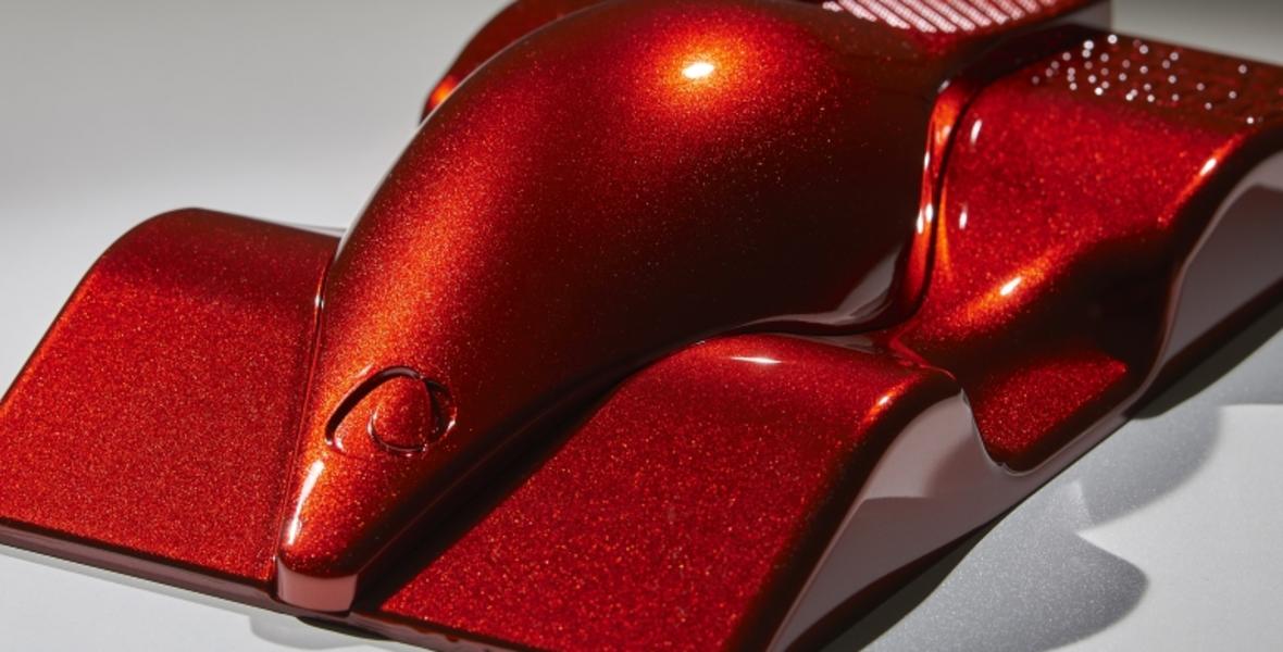 Car shape coated with LUXAN Spotlight Red pigment